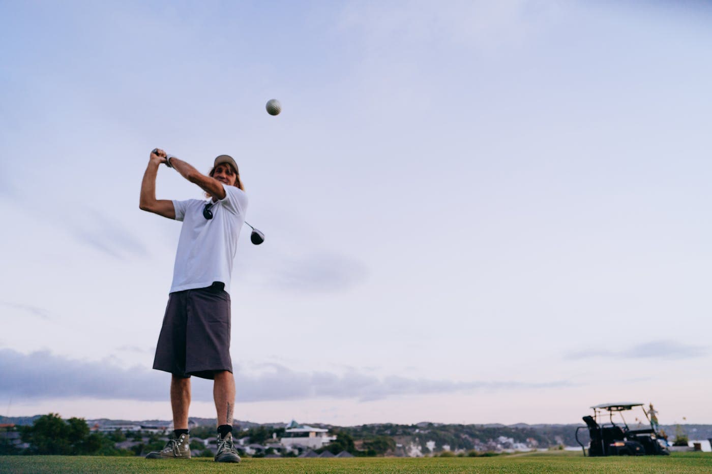 Man playing golf on a UK parkland course