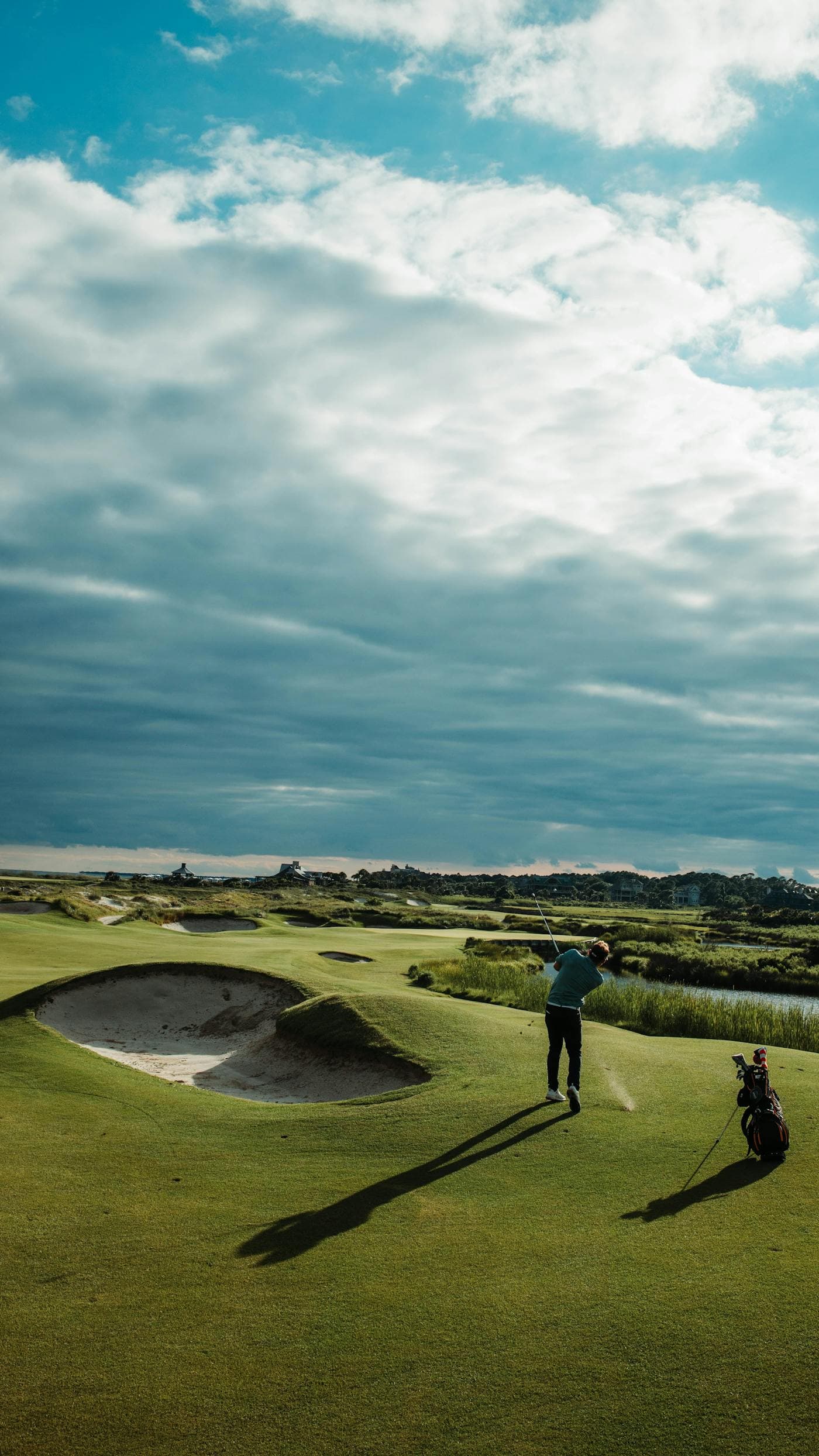 Golfer on a UK parkland course in the morning light